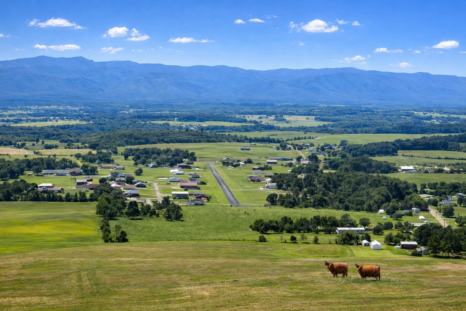 Greeneville, TN drone photography looking over downtown Greeneville with Blue Ridge Mountains in the distance